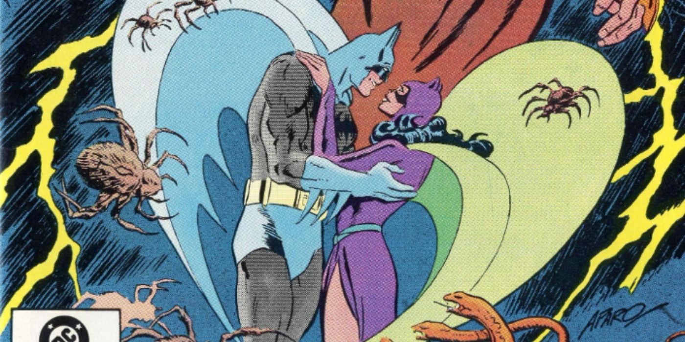 Batman and Catwoman embrace in DC Comics.