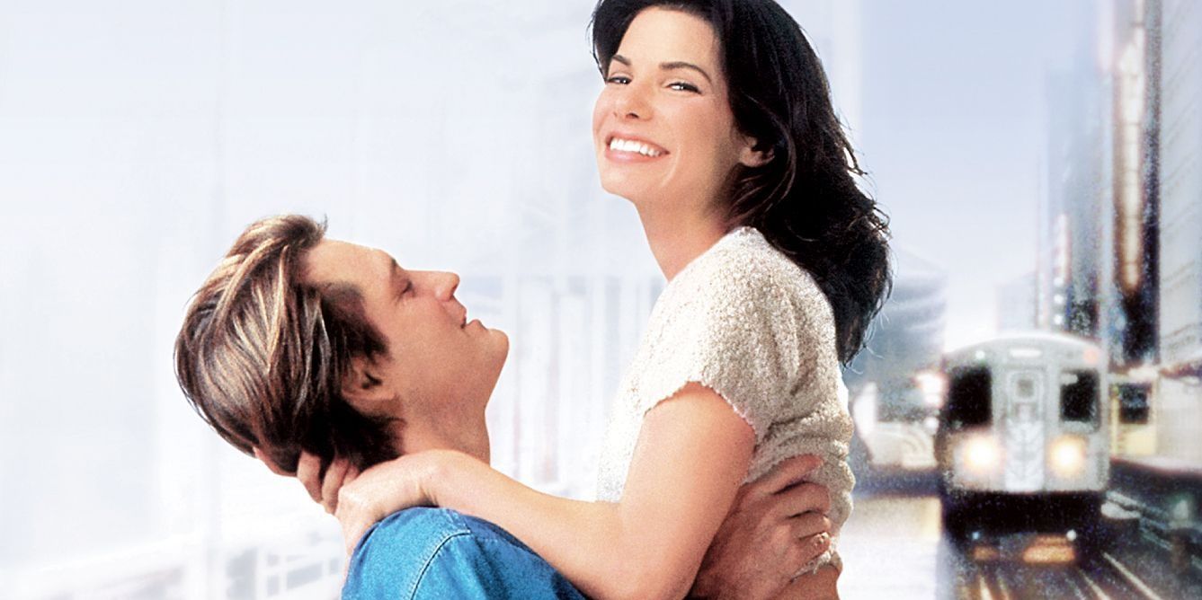 Bill Pullman lifts up Sandra Bullock in While You Were Sleeping