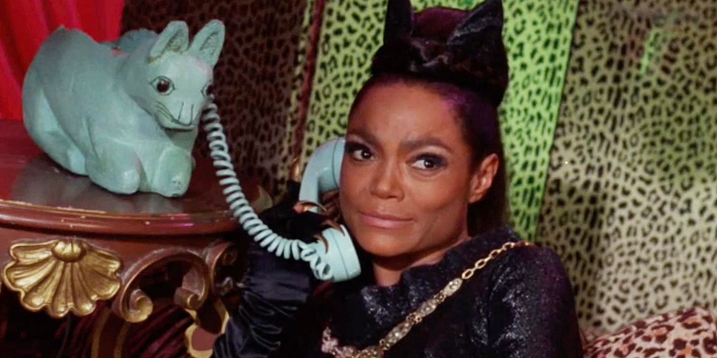 Catwoman talking on the phone.