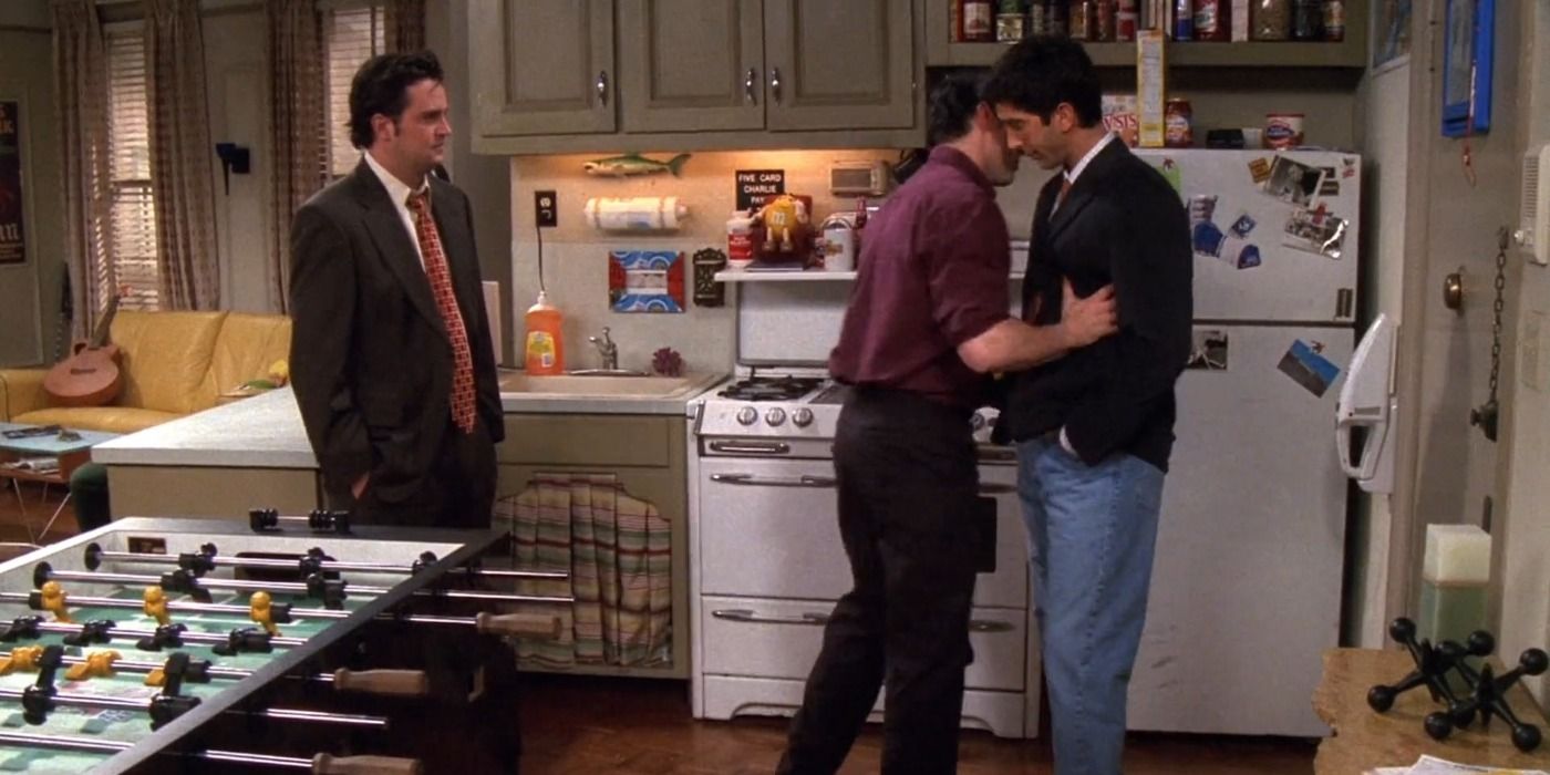Chandler stands by as Joey pushes Ross into his fridge in Friends