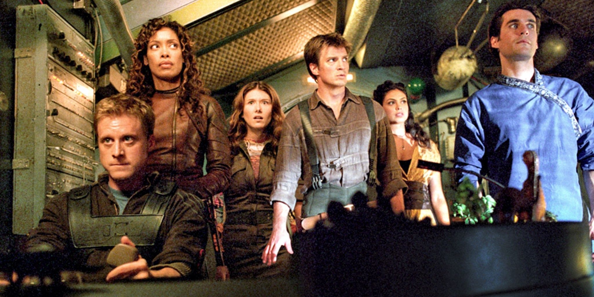 Characters looking scared on a spaceship in Serenity 2005 