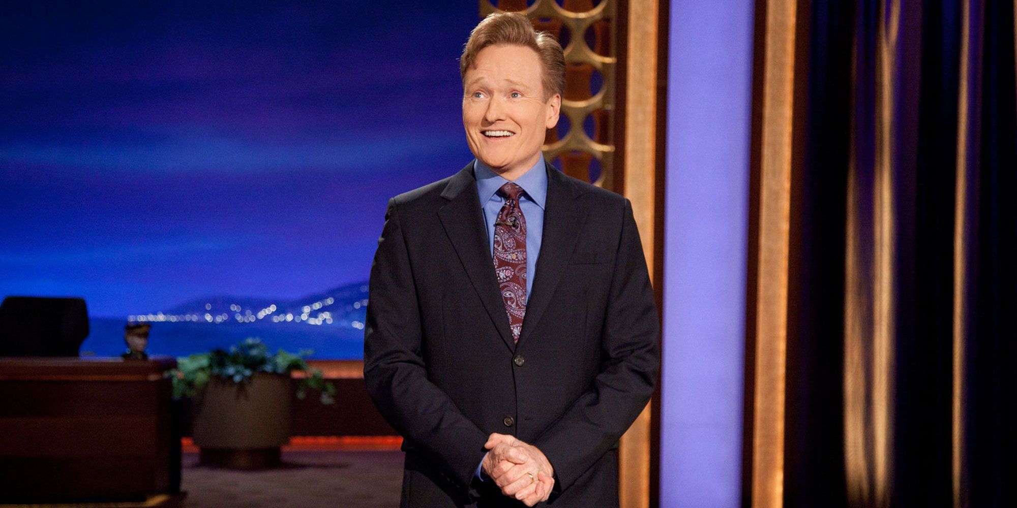 Conan O'Brien on stage smiling