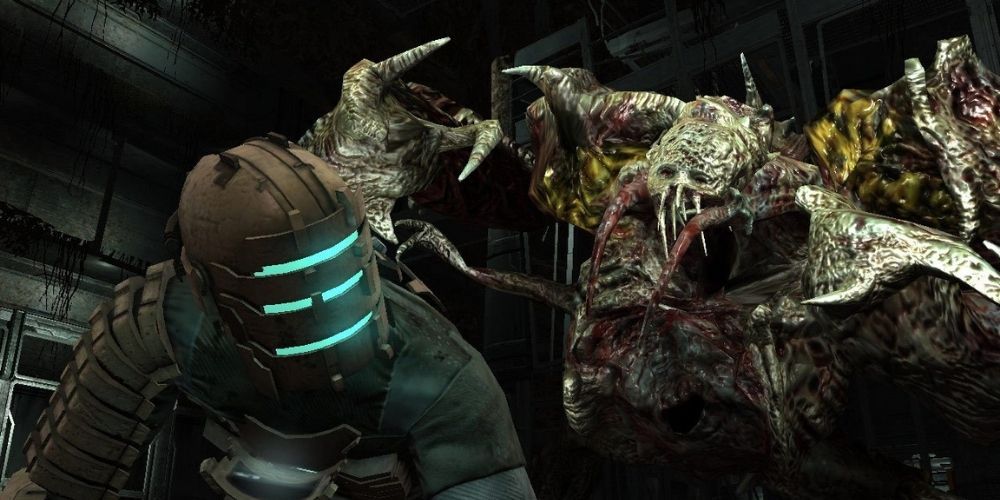 Isaac Clarke gets pounced by one of the necromorph aliens in Dead Space