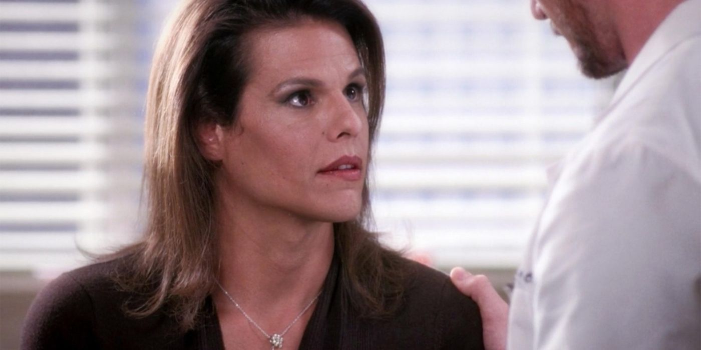 Donna looking at Mark Sloan in the hospital room as he tells her she has breast cancer.
