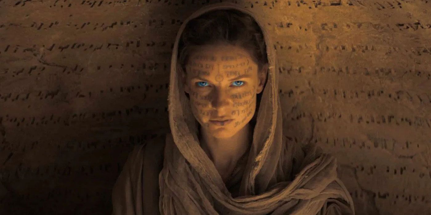 A Bene Gesserit woman with glowing blue eyes.