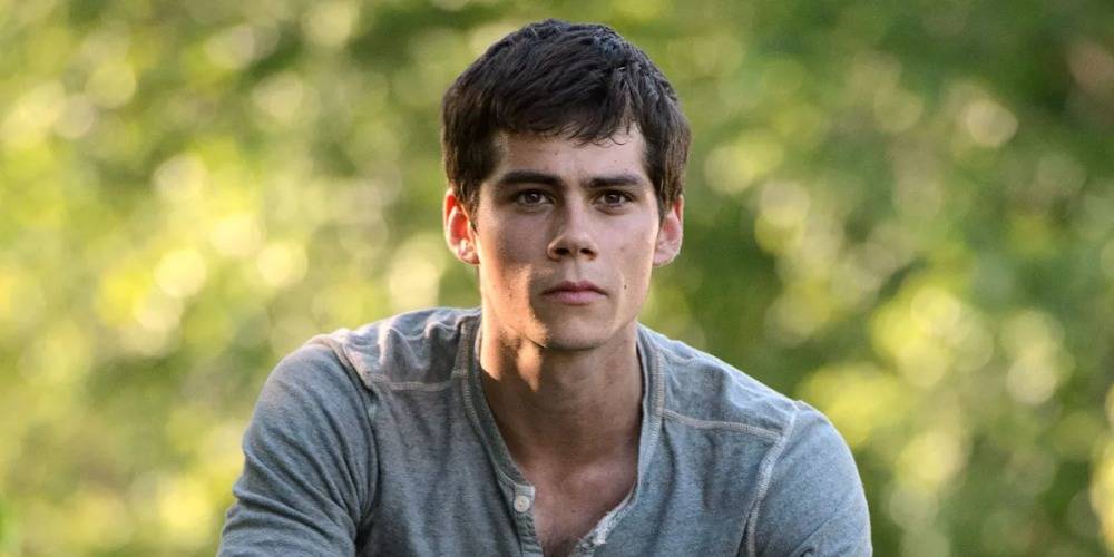 Dylan O'Brien in The Maze Runner outside with a blurred tree background