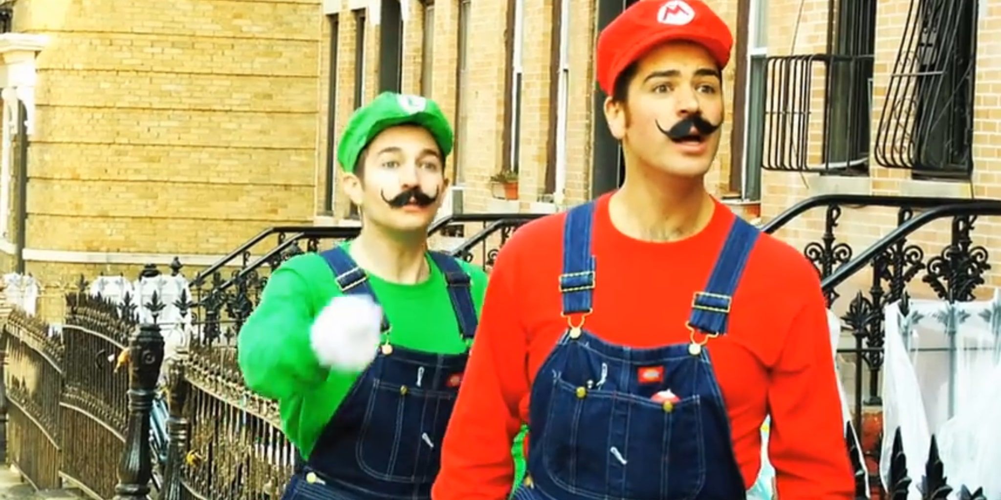 Mario and Luigi stare in horror as Bowser kidnaps Princess Peach.