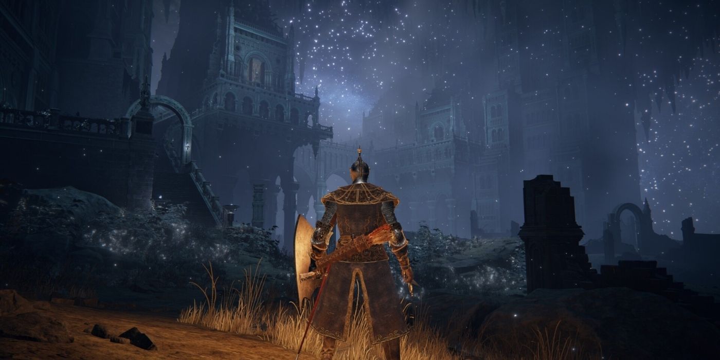 A character standing in front of a city at night in Elden Ring