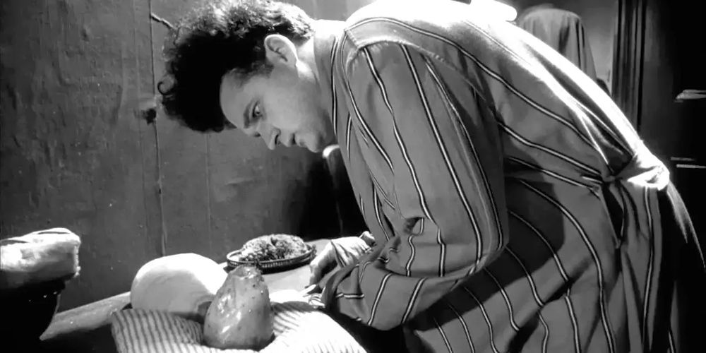 Henry inspects his baby in Eraserhead