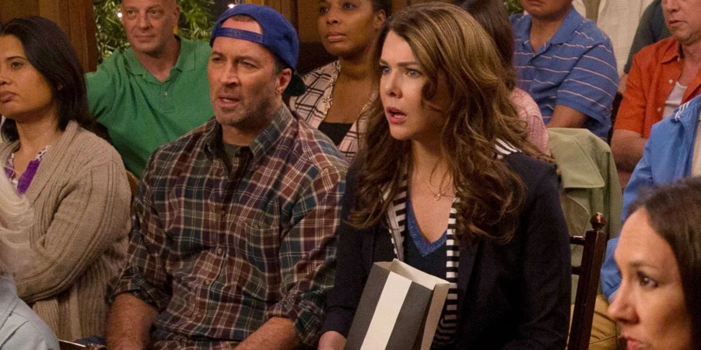 Luke and Lorelai looking shocked at a town meeting in Gilmore Girls: A Year In The Life