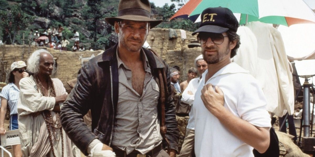 Steven Spielberg gives instructions to Harrison Ford on the set of Indiana Jones