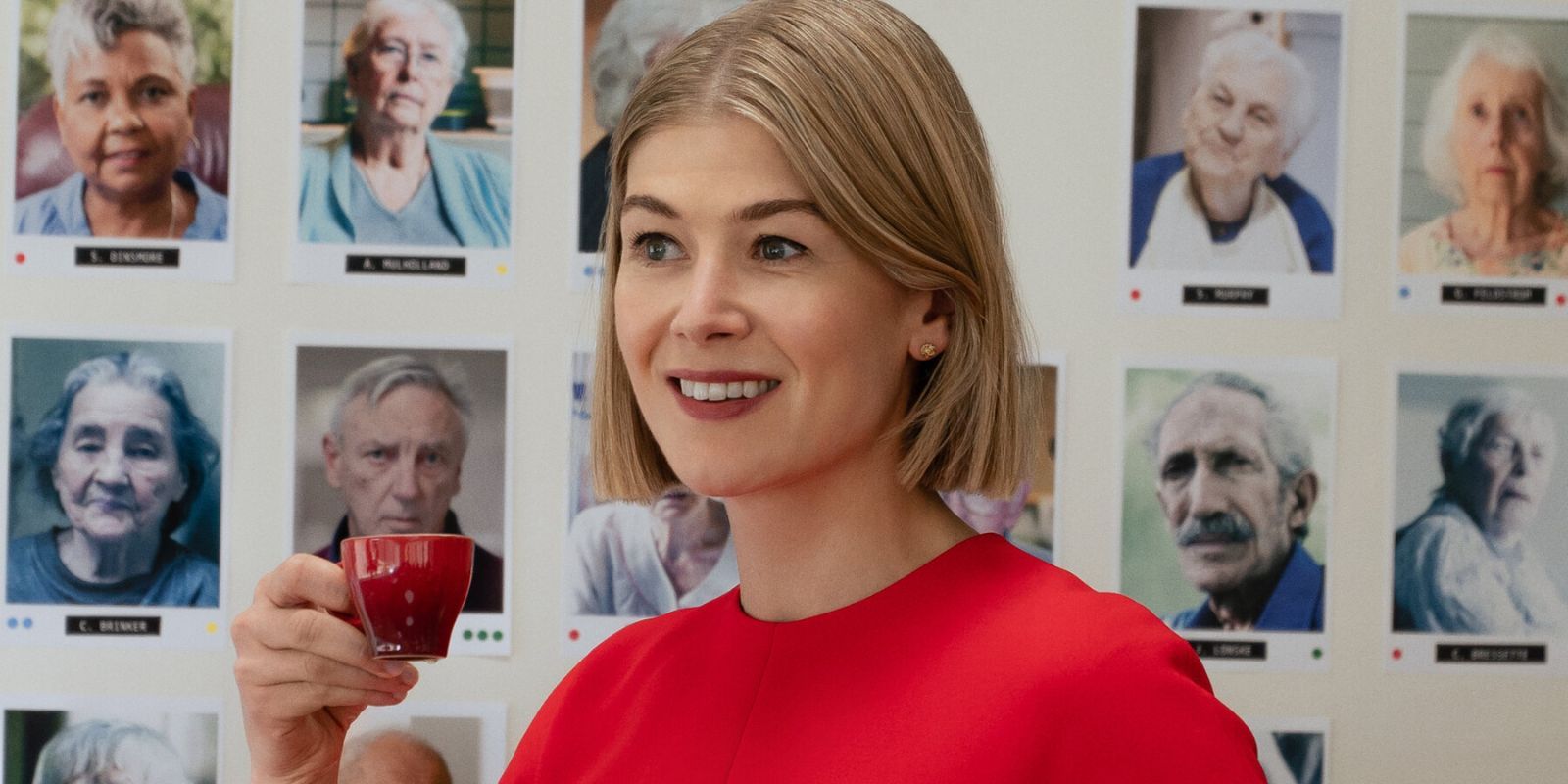 Rosamund Pike smiling in still from I Care a Lot