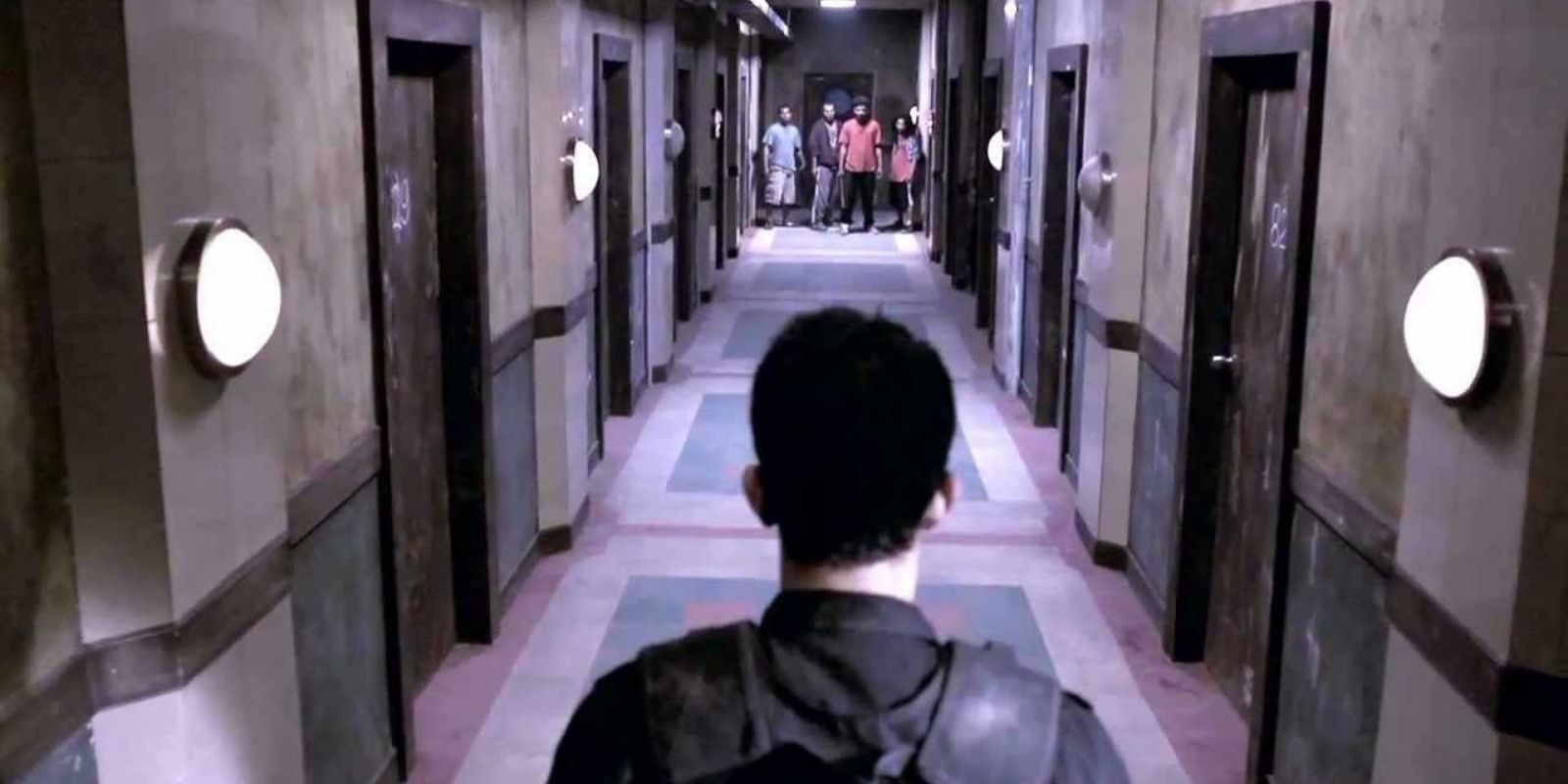 Iko Uwais in hallway scene of The Raid