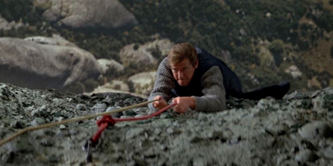 James Bond climbing up a cliff face in For Your Eyes Only