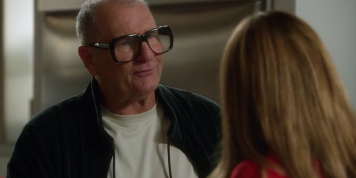 Jay's wearing his new glasses while talking to Gloria on Modern Family