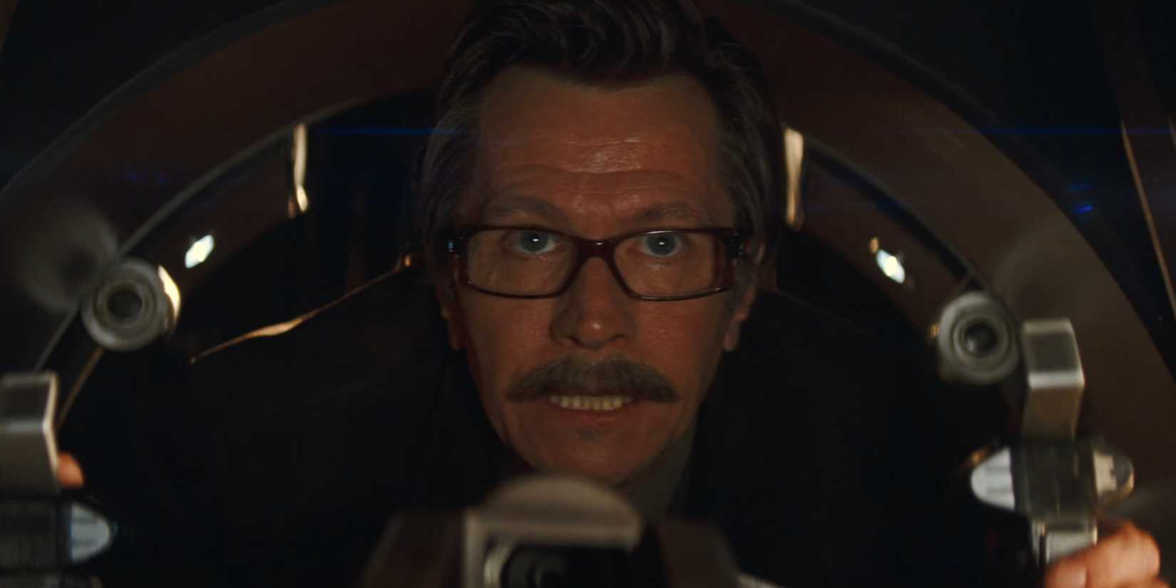 Jim Gordon piloting the Tumbler in weapons mode in Batman Begins