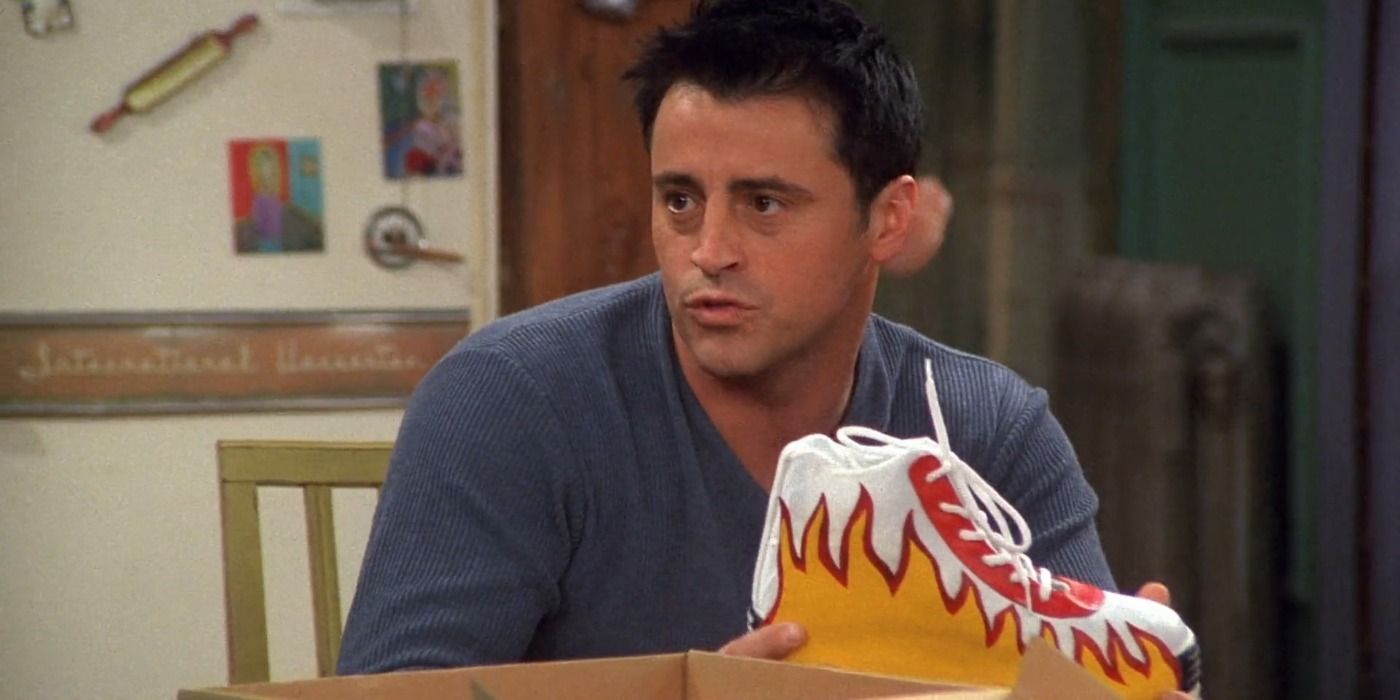 Joey holding Chandler's prototype sneakers while at Monica's in Friends