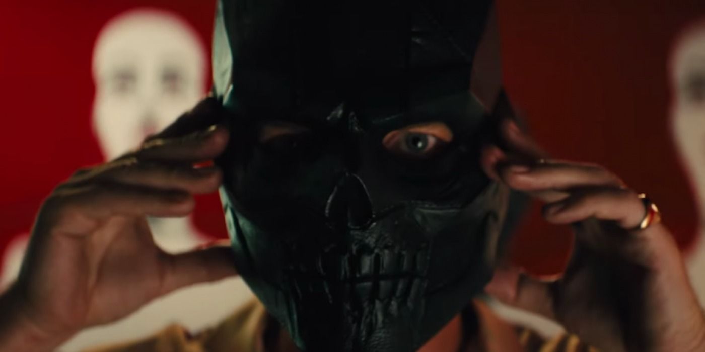 Roman putting on the mask in Birds of Prey