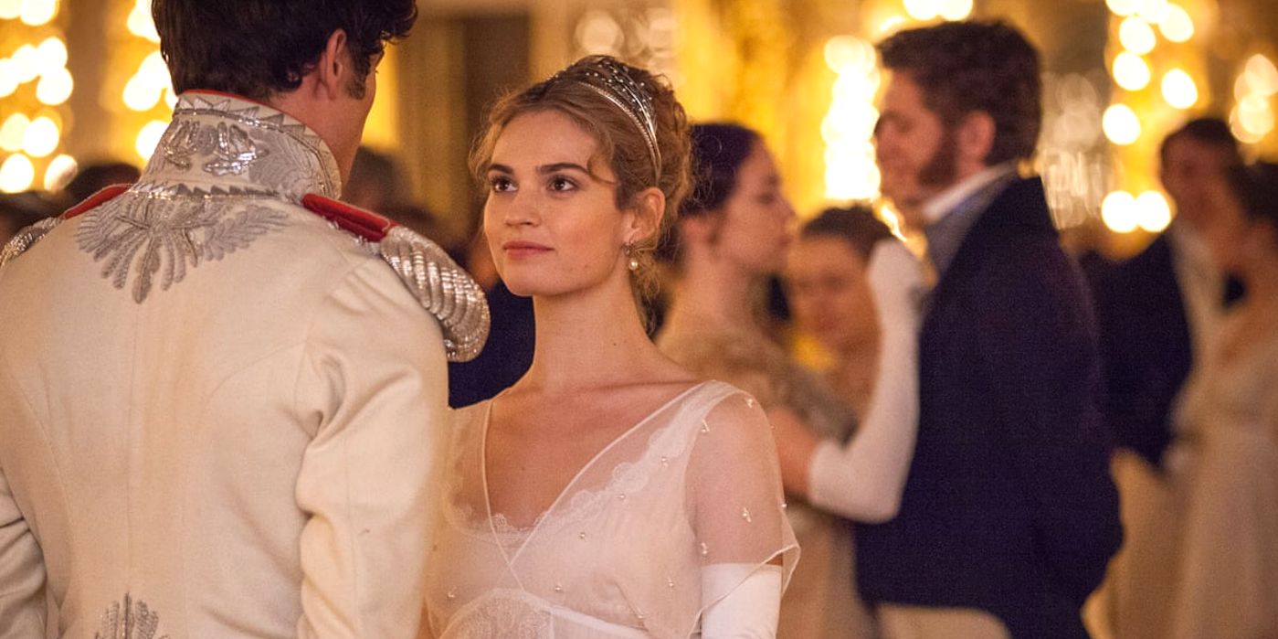 Lily James smiling in a ballroom in War and Peace