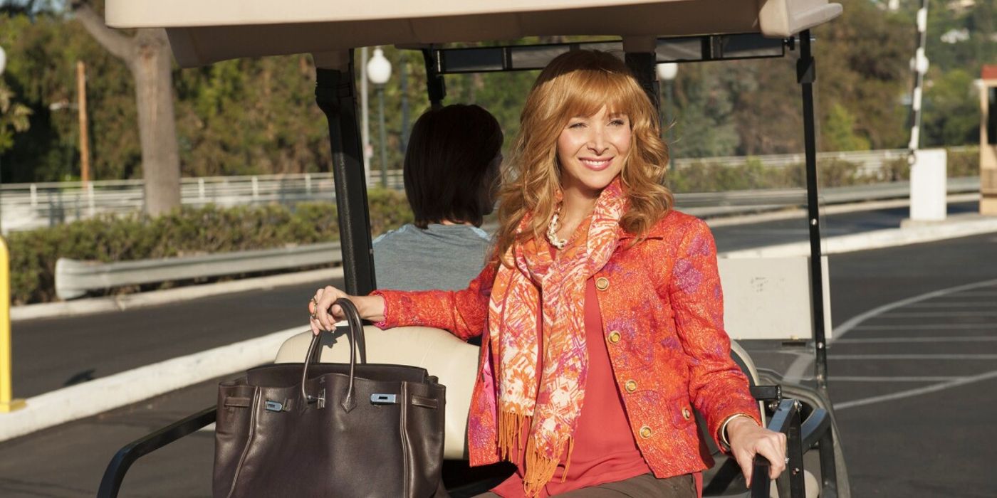 Lisa Kudrow as Valerie Cherish riding in a golf cart in The Comeback