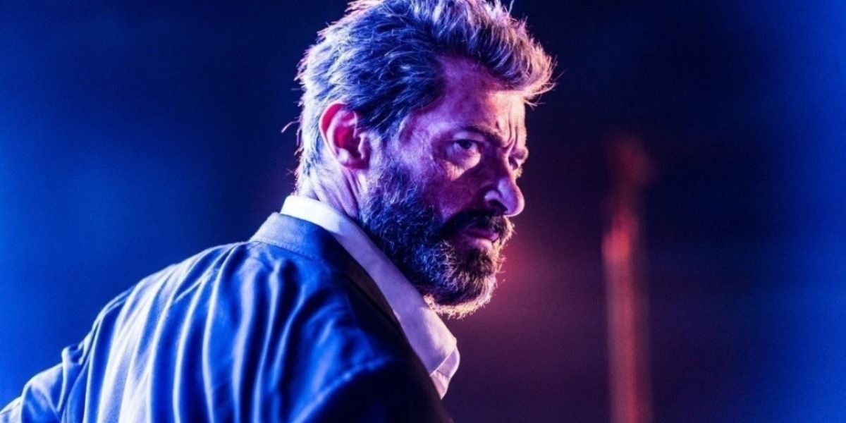 An older Wolverine surrounded by neon light in the opening of Logan.
