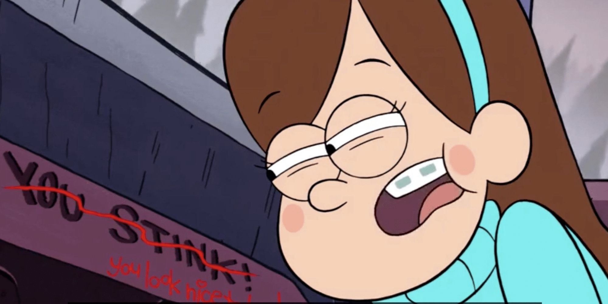 Mabel squints at a message on Gravity falls