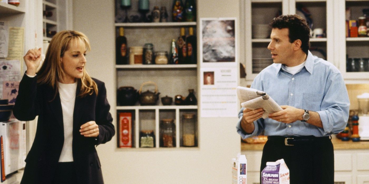 Jamie and Paul standing in the kitchen on Mad About You