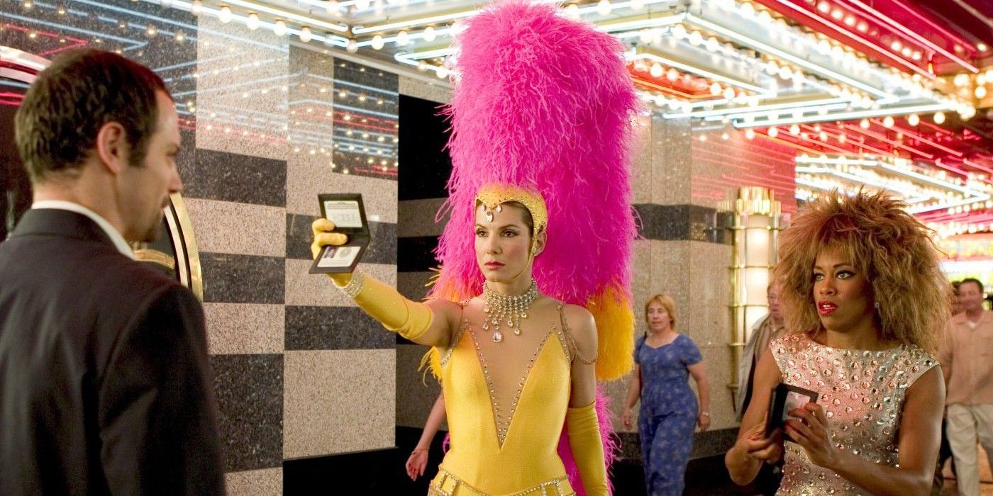 Agent Grace Hart (Sandra Bullock) shows her badge while dressed as a Vegas show girl in Miss Congeniality 2.