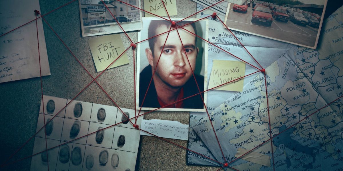 A photograph is pinned to a board with red strings from Puppet Master