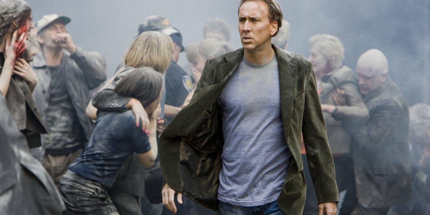 Nicholas Cage in a crowd of people and dust in Knowing.