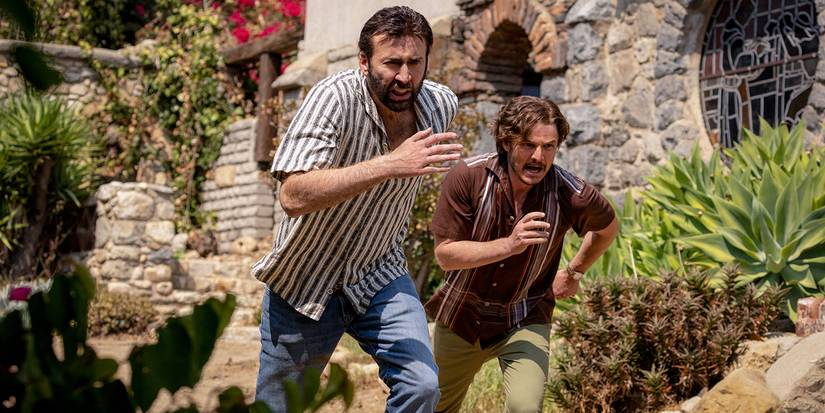 Nicolas Cage and Pedro Pascal running in The Unbearable Weight of Massive Talent