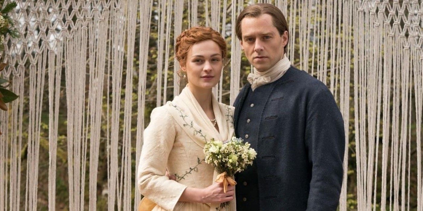 Roger and Brianna holding flowers at their wedding on Outlander