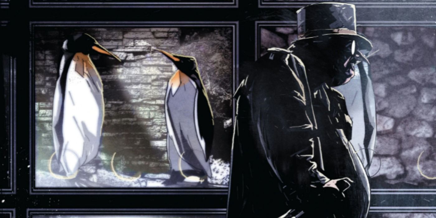 Penguin walking by a cage of penguins.
