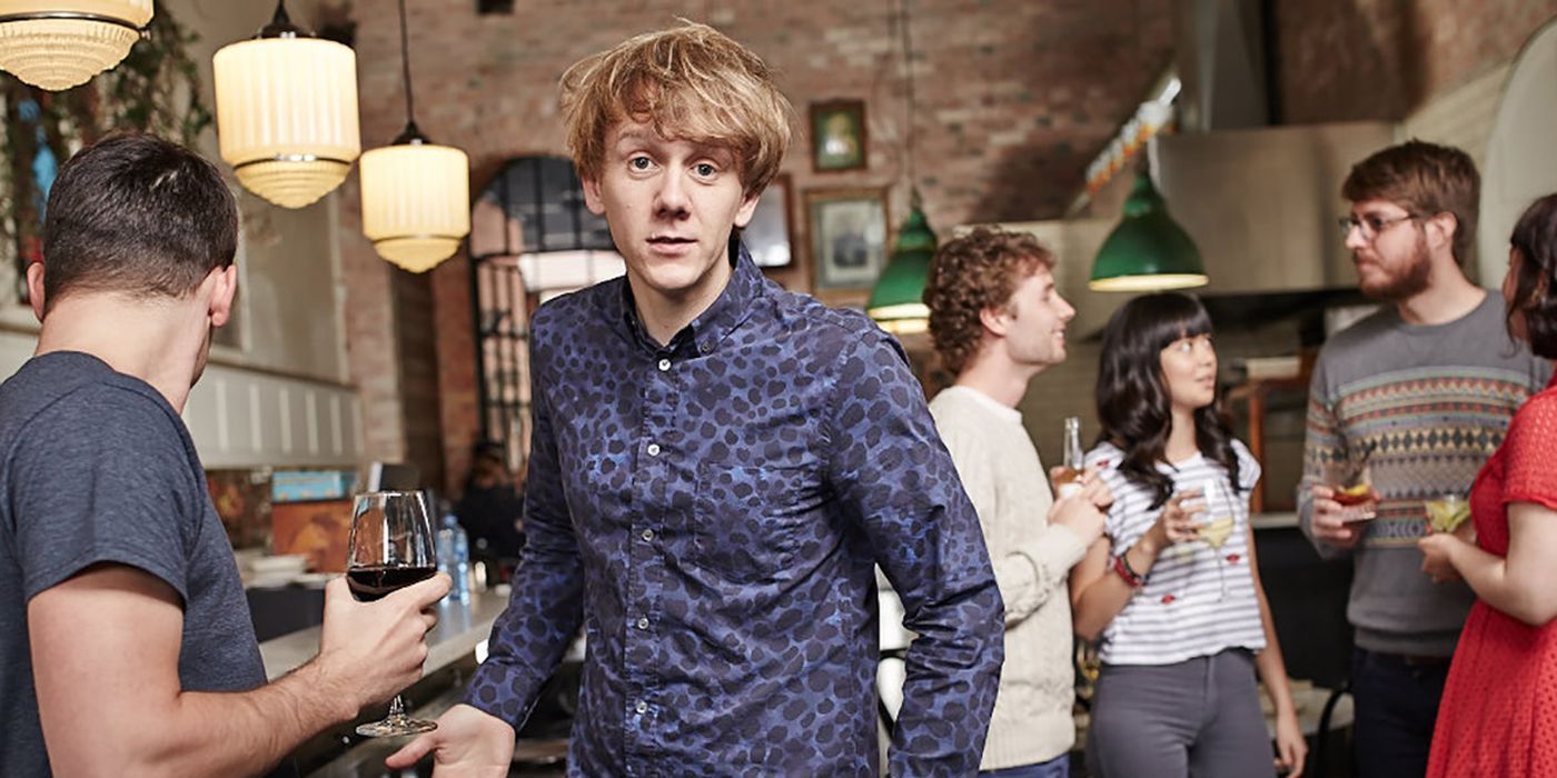 The cast of Please Like Me TV Show in a bar while one man stares directly at the camera