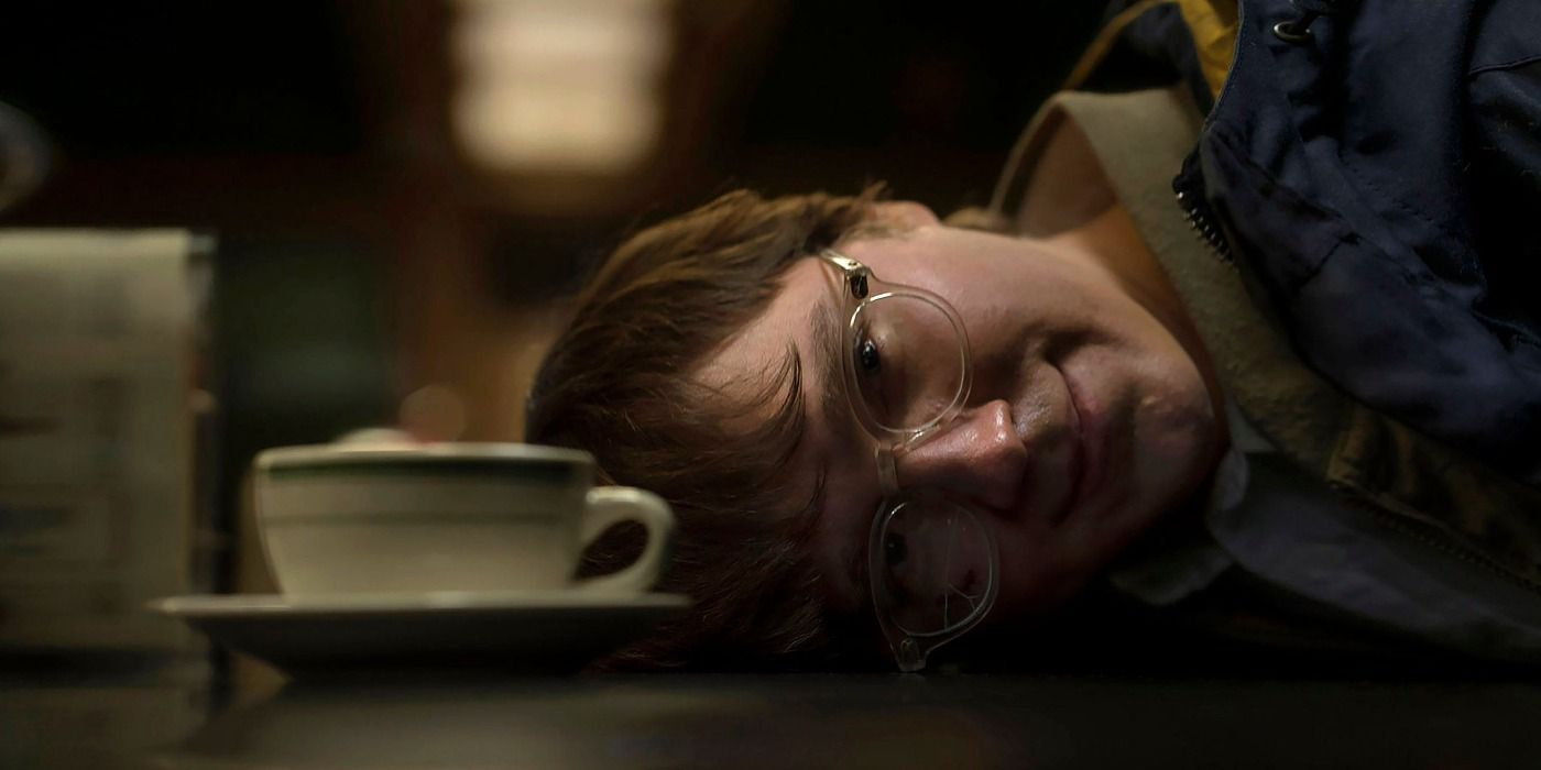 Riddler smiling as he is arrested in The Batman