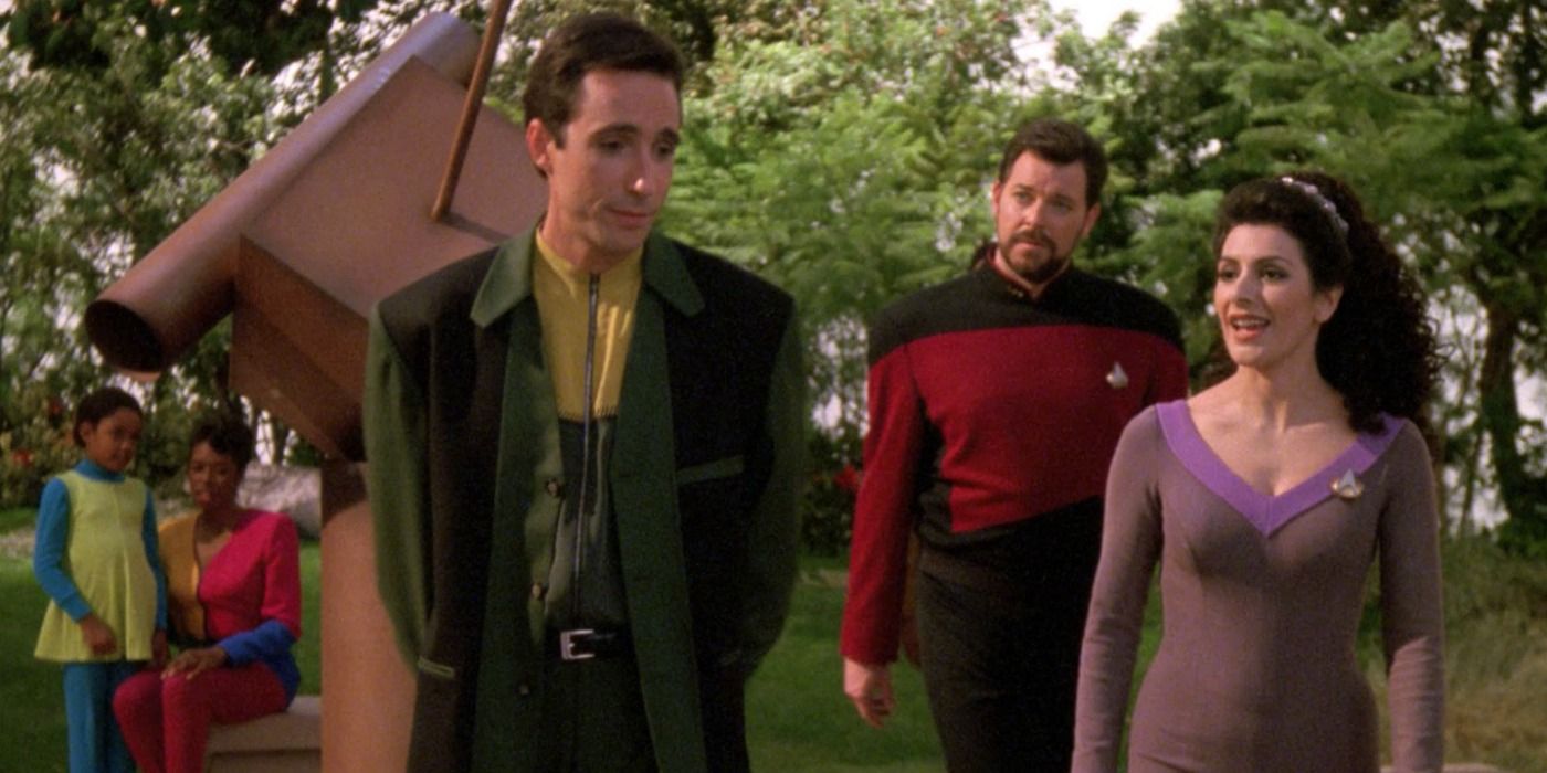 Riker and Troi meet an alien in The Masterpiece Society.