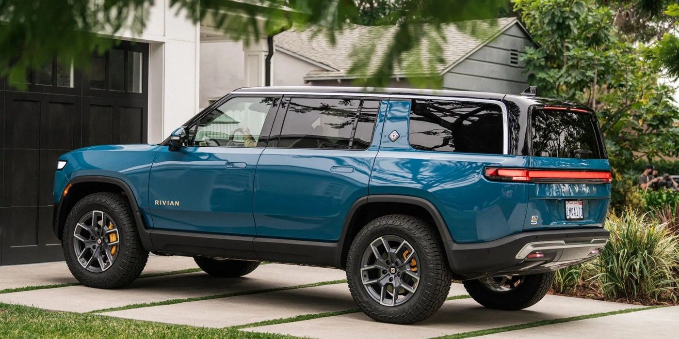 The Rivian R1S parked in a driveway.