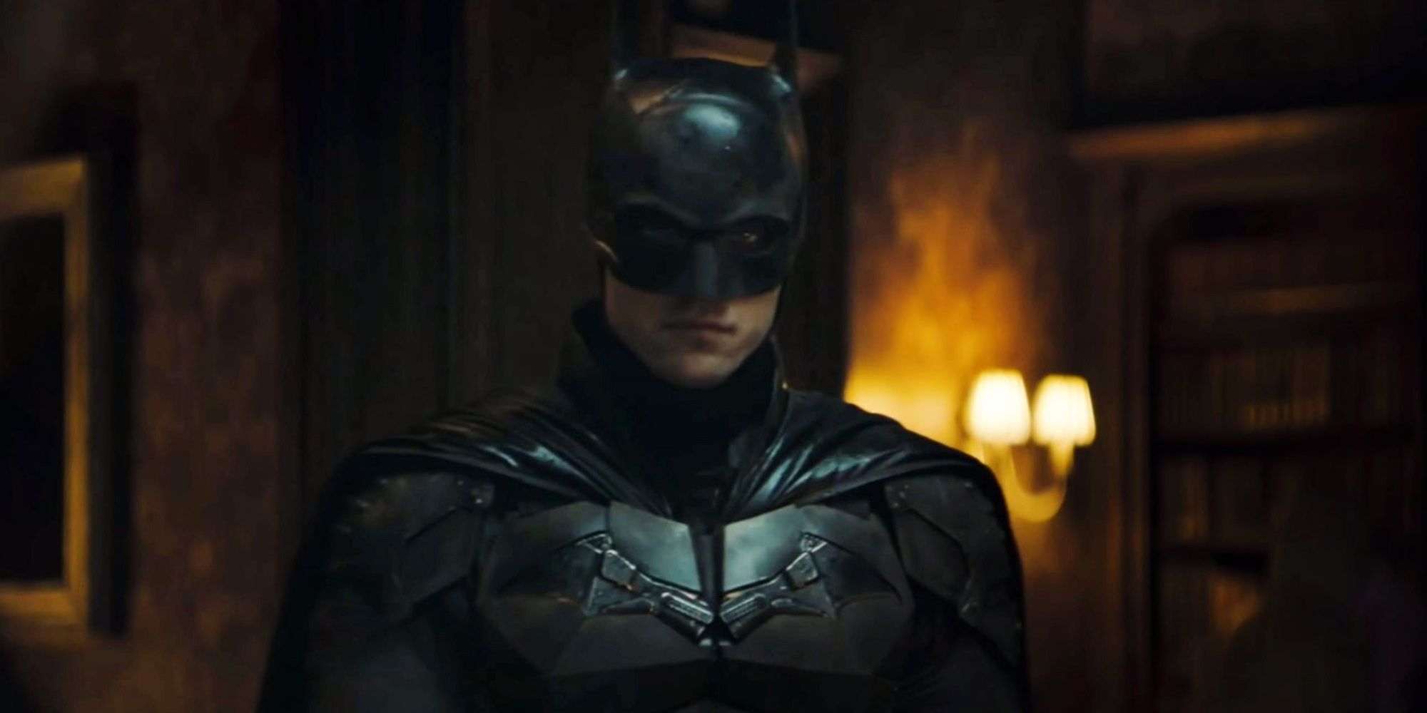 Batman standing in the middle of a room in The Batman