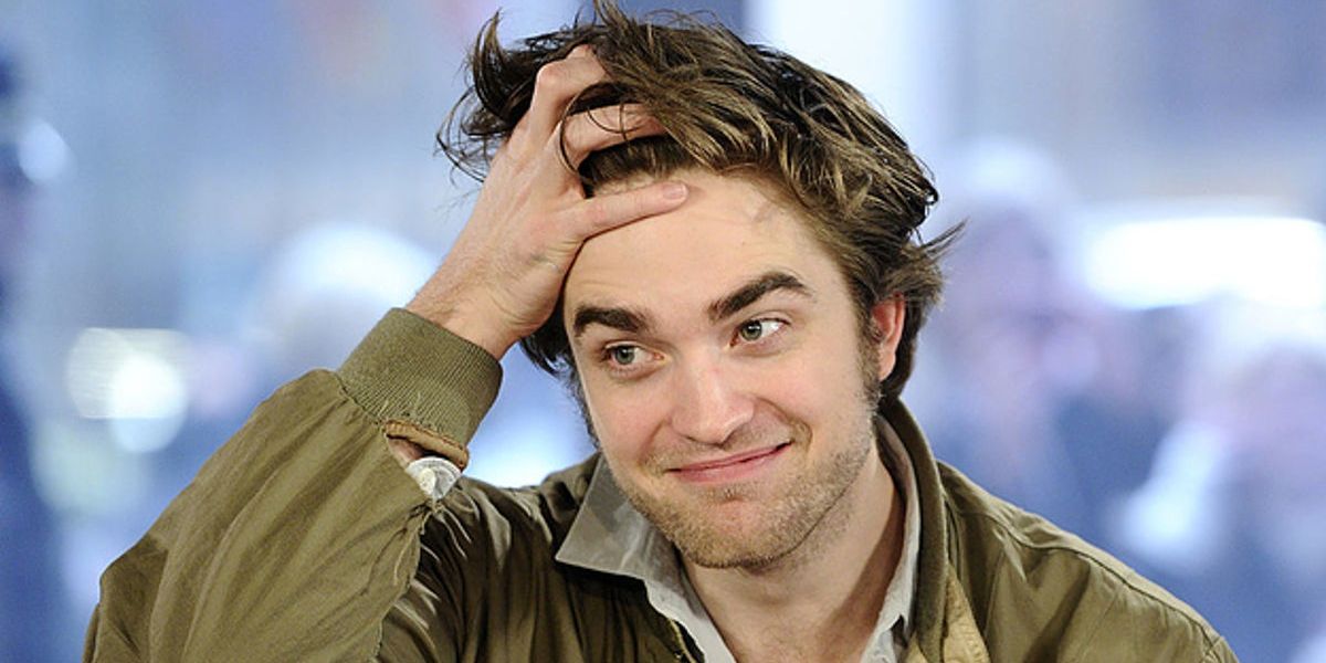 Robert Pattinson with hand in hair