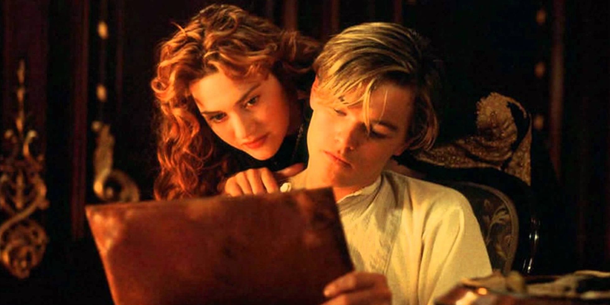 Rose and Jack looking at a picture of her on the Titanic.