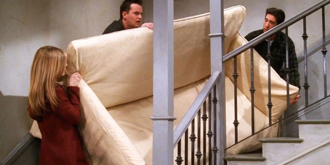 Ross, Phoebe and Chandler carrying a couch up Ross's New Aparment Stairs