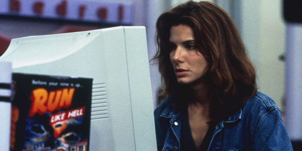 Sandra Bullock stares at a computer screen in The Net 