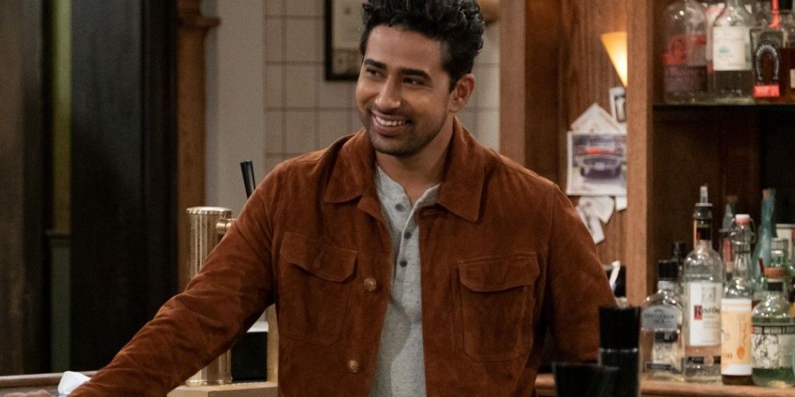 Sid laughs while working at the bar in How I Met Your Father Cropped