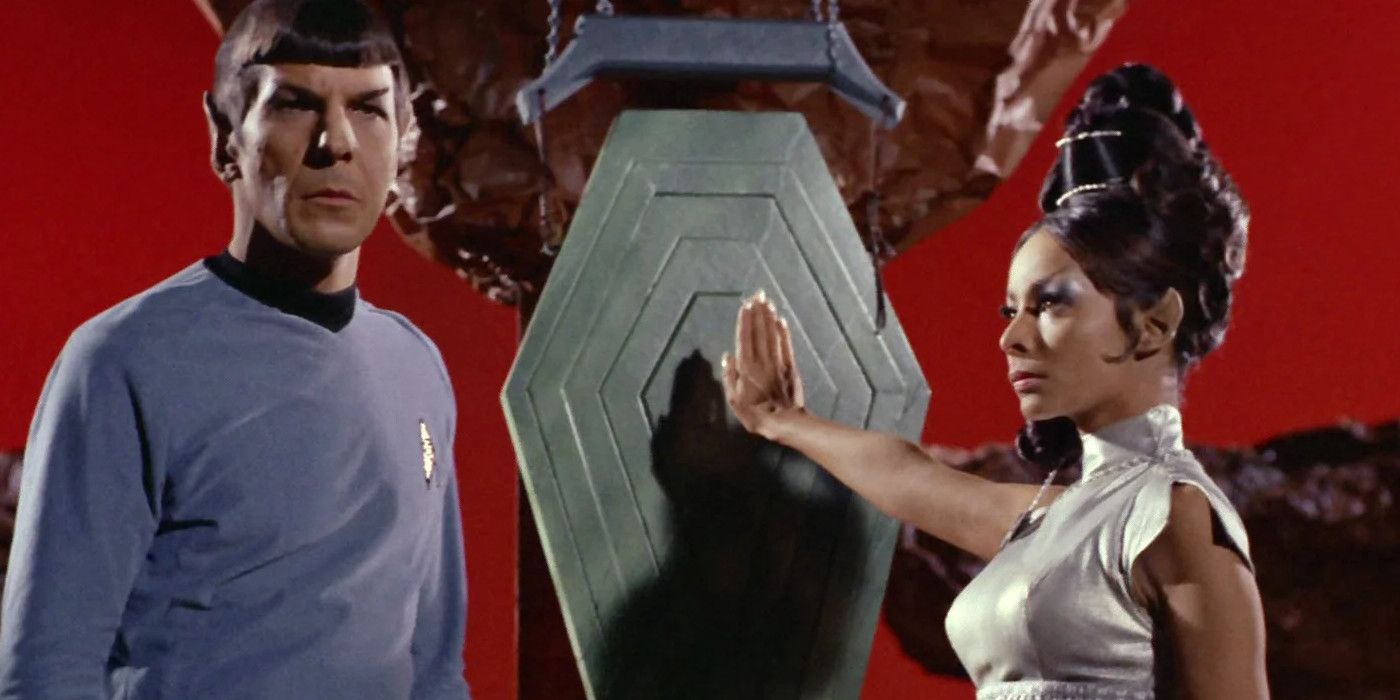 Spock and T'Pring stand near a gong from Amok Time.