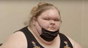 Tammy Slaton in 1000-lb Sisters looking sideways with black mask and black dress