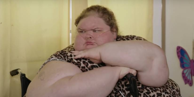 Tammy Slaton pouting in 1000-lb Sisters looking angrily wearing animal print dress