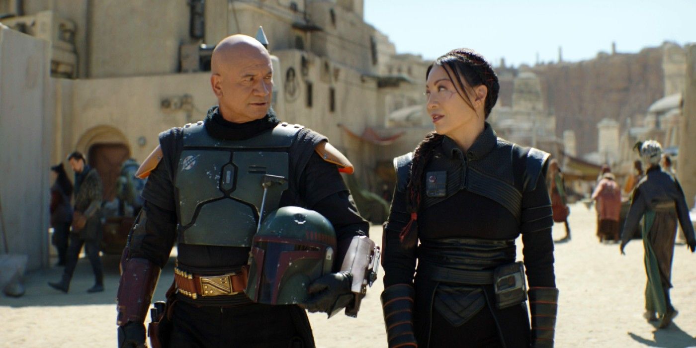 Temuera Morrison and Ming Na Wen walking through Tatooine in The Book of Boba Fett