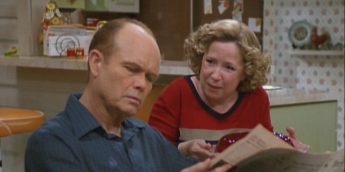 Red reads the newspaper while Kitty talks from That 70s Show