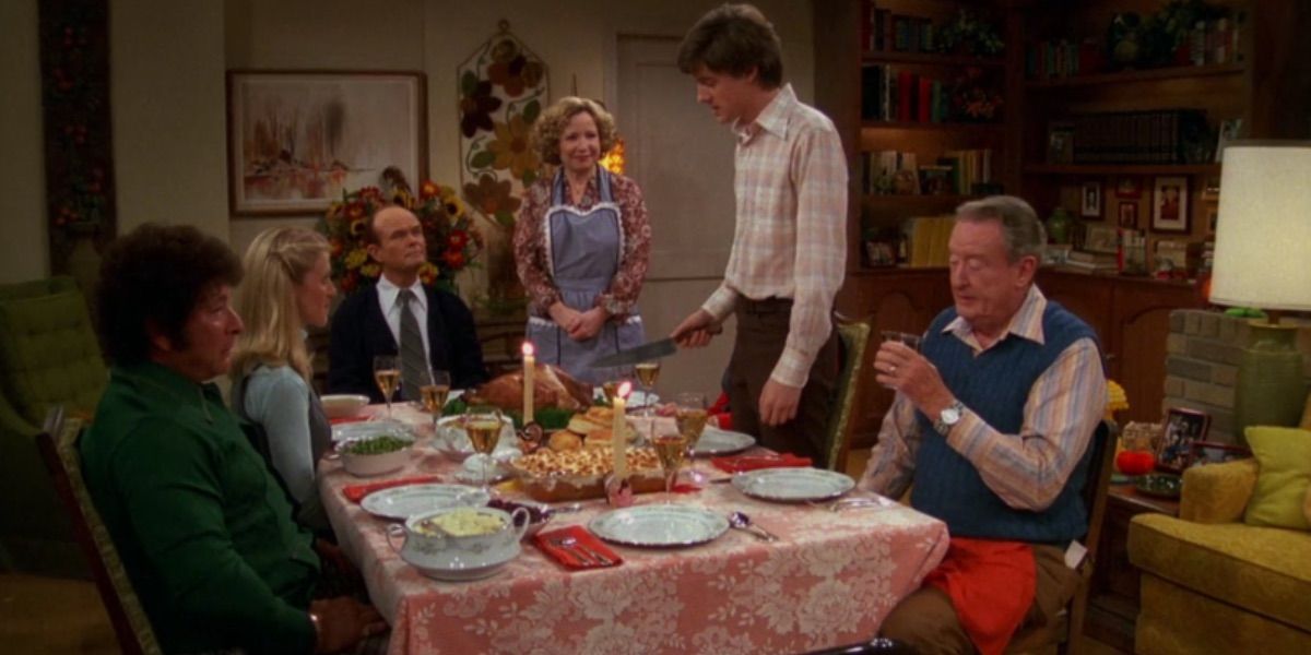 Eric stands to cut the turkey from That 70s Show