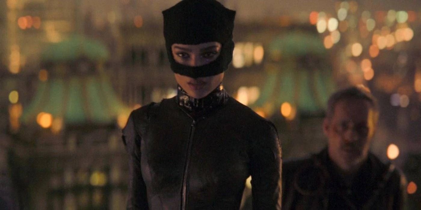 Catwoman with a bound officer Kenzie behind her in The Batman